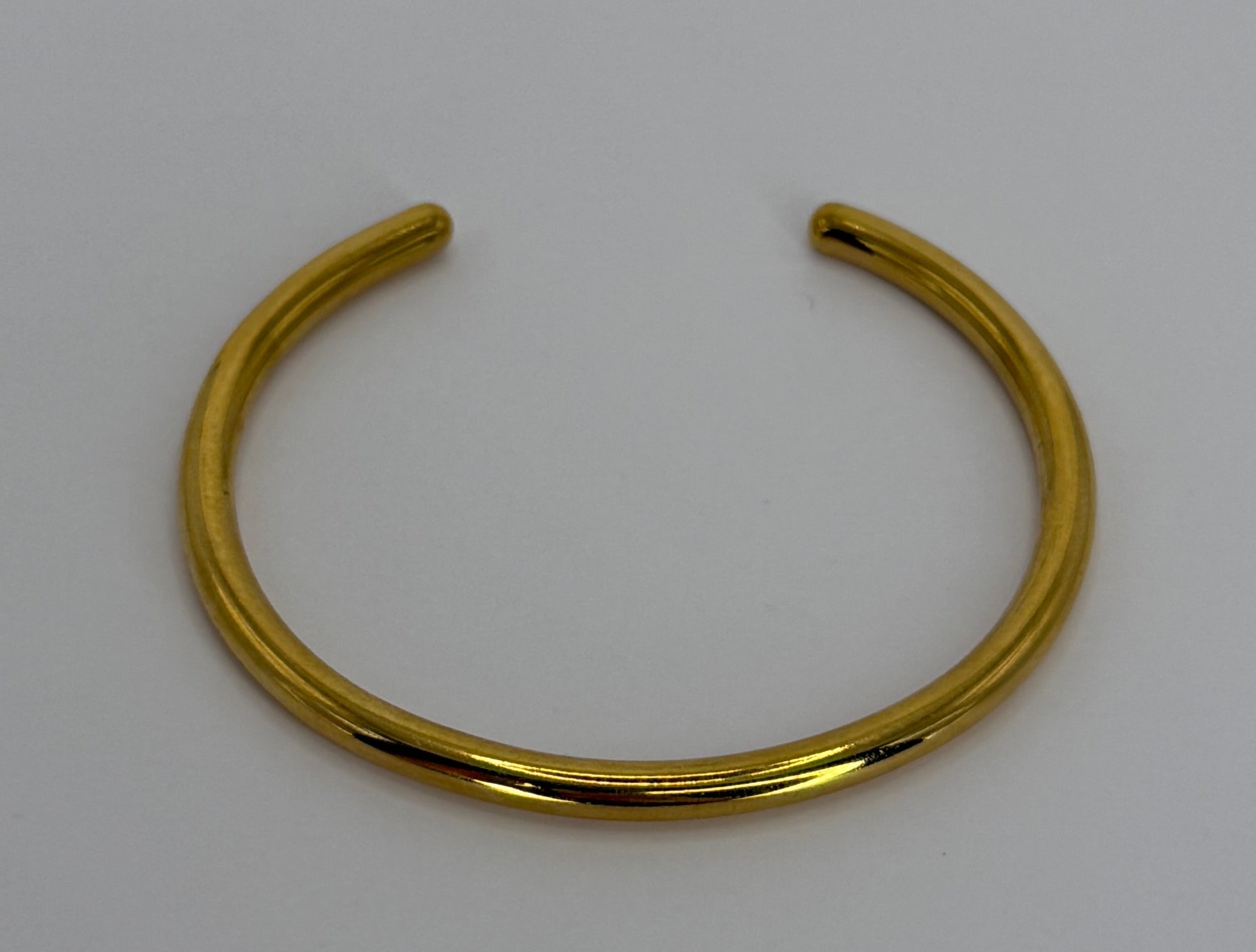 Bracciale rigido aperto dorato minimal
